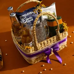 A curated beer basket for the enthusiast. We include your choice of beer, a classic beer mug, and a selection of savoury snacks like cashews, popcorn, and garlic toast.