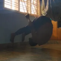 Exploring a deep spinal extension and shoulder flexion using a DIY rope setup at home. This helps prepare the body for advanced backbends by working against gravity.