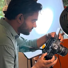 Focused on the details. Here I am setting up a shot for a food photography session, making sure the lighting is perfect to make the dish look as appetizing as possible.