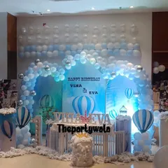 Up, up, and away! This Hot Air Balloon theme is perfect for a first birthday, with a beautiful blue sky backdrop, fluffy balloon clouds, and cute hot air balloon models. I can customize the colors for a baby boy or girl.