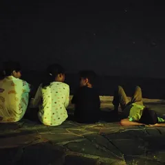 Stargazing by the sea. Away from the city lights, the night sky opens up, offering a breathtaking lesson in astronomy and our place in the universe.