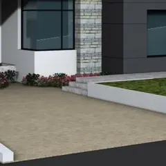 A close-up render of a building's foundation and landscaped edge. This image details the transition from the building's stone-clad base to the surrounding pavement and lawn area.