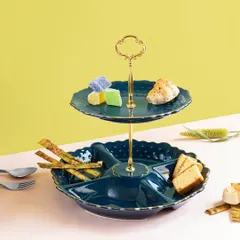 This two-tiered serving stand in a deep teal is both stylish and practical. The lower dish is partitioned for different snacks, while the upper tier is perfect for small bites or sweets.