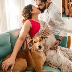 An intimate at-home maternity photo showing an expecting couple kissing while their indie dog sits calmly on the couch with them.