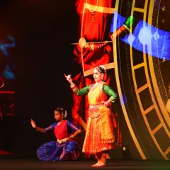 A close-up of a dancer during the AWS AI Conclave performance. The background visuals, generated by AI, respond to the dance, making each performance a unique collaboration between the artist and the algorithm.