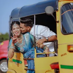 Fun, spontaneous moments are just as important as the formal ones. This playful shot of a couple in an auto-rickshaw captures the joyful spirit of their wedding day in Bangalore.