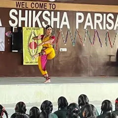 A dynamic pose captured during a workshop demonstration for school students. In these sessions, I break down the elements of Bharatanatyam, explaining the stories, expressions, and rhythms to make the art form engaging and understandable for a new audience.