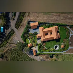 An aerial perspective of a large-scale institutional project, showcasing how I integrate manicured lawns, curving pathways, and dense green belts with the property's architecture. This view demonstrates my capability in master planning and executing complex, large-format landscape designs.