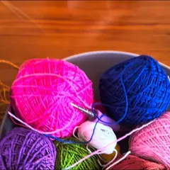 A bowl of vibrant yarn, ready to be turned into a beautiful creation. Choosing the colors is one of the most exciting parts of the process.