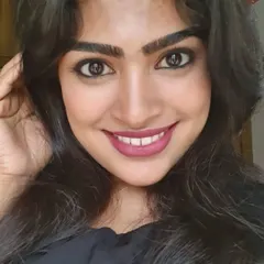 A close-up of a simple yet impactful party look. This focuses on a defined eye with kohl and a beautiful matte pink lipstick that brightens the face.