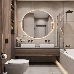 A spacious bathroom with a double vanity unit. The design features two vessel sinks on a floating wood-finish console and a large, circular backlit mirror.