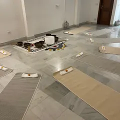 The setup for a sound healing workshop, ready to welcome you. Each mat is a space for you to lie back, let go, and allow the therapeutic vibrations of the singing bowls to restore your inner harmony.