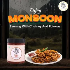 Enjoy a perfect monsoon evening with crispy onion pakoras and our spicy Rajasthani Lehsun Chutney. It's the ideal combo for a rainy day.
