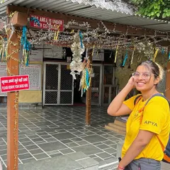 A student at a local temple during our Rishikesh YTTC. The training goes beyond the mat, incorporating cultural and spiritual immersion.