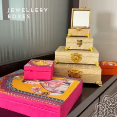 A beautiful arrangement of my jewelry box collection. It shows the classic brocade boxes alongside the vibrant, modern Raja-Rani printed boxes, highlighting the variety of styles I offer.