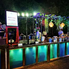 Presentation matters just as much as taste. Here is one of our beautifully arranged rice and dal stations at an event at Novotel Imagica, complete with elegant lighting and decor to match the party's theme.