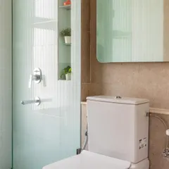 Pastel tiles for the win. The fluted texture of these light blue tiles adds a subtle, sophisticated detail to the shower area.