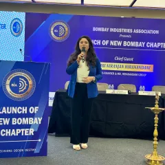 On stage anchoring the launch of the Bombay Industries Association (BIA) New Bombay Chapter. A professional host ensures the event flows smoothly, keeping the energy high and the focus on the important milestones being celebrated.