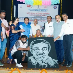 Presenting the finished portrait of the Bangalore University Vice-Chancellor at the India Youth Parliament event. Live art is a powerful way to commemorate an event and honor special guests.