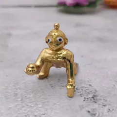 This adorable Panchaloham baby Krishna idol is a budget-friendly gift that brings immense joy. Its golden finish and crawling pose are beautifully captured.