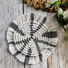 Are you looking for the perfect companion for your favorite cup of coffee? This pretty macrame coaster, with its grey and white spiral pattern, is a great eco-friendly choice. It can also be used to display small decor pieces or candles.