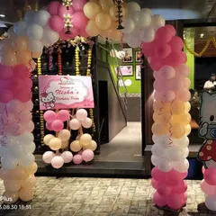 The entrance to the Hello Kitty party, showing the welcome sign and balloon arch that immediately sets a fun and inviting tone.
