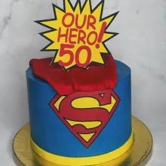 A Superman-themed cake for a 50th birthday, because dads are heroes too. The bold colors, iconic logo, and flowing cape make this a powerful and fun centerpiece for a milestone celebration.