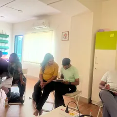 It's not just physical work. Here, couples are taking notes and engaging with the informational part of our workshop, learning to make informed decisions for their birth journey.