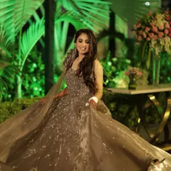 A twirl-worthy moment. The makeup was designed to catch the light as she moved, with a focus on highlighter and a shimmery eyeshadow that sparkled all night.