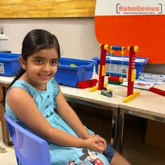 Our robotics journey starts as early as kindergarten. Here, one of our youngest students proudly displays the functional swing she built using a LEGO robotics kit, demonstrating how we make fundamental engineering concepts accessible and fun from day one.