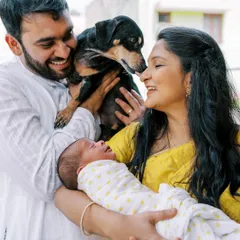 From bump to baby. This photo shows a beautiful family with their newborn and their dog, capturing the joy of finally being all together. I am happy to document these first moments at home.