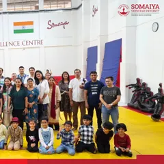 Parents and young athletes gather on the mats at our Judo Excellence Centre, highlighting our community-focused approach to training.
