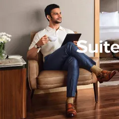 This shot for Conrad Pune captures the essence of a business traveler relaxing in style. I chose a smart polo shirt, checked trousers, and distinctive socks to create a look that is both professional and comfortable.
