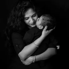 There is a special kind of quiet in moments like these. This black and white portrait captures the pure, unconditional love in a mother's gentle kiss. My goal is always to create timeless images that let the emotion speak for itself.