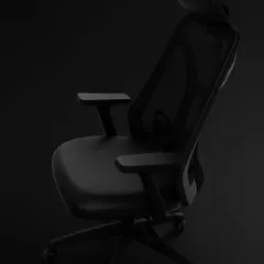 A full view of our black ergonomic task chair. The design features a high mesh back with an adjustable headrest, a cushioned seat, and a sturdy base, offering a complete solution for workday comfort.