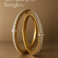 Here are two bangles that tell one timeless story. Crafted with intricate gold filigree and wrapped in a layer of brilliant diamonds, this pair is a nod to craftsmanship that values detail, precision, and a sense of permanence. They are made for wrists that carry tradition into the now.
