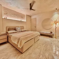 This bedroom is a retreat from the world, wrapped in the warmth of lime-washed walls and soft, ambient light. I designed a custom bas-relief art piece above the bed that interacts with the hidden lighting, creating subtle shadows and depth. The space is intentionally minimalist, using a neutral color palette and natural textures like the marble floor and soft textiles to promote rest and serenity.