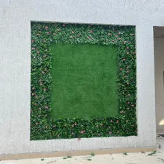 A unique framed design I installed in Theog, Himachal Pradesh. The outer border of flowering leaves contrasts with the simple artificial grass center, creating a piece of natural art on the wall.