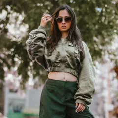A confident standing portrait from the same streetwear shoot. The model's pose and expression perfectly capture a cool, urban vibe.