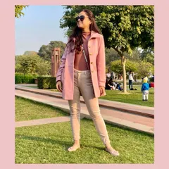 A monochrome look in shades of pink and beige is a soft and elegant way to do winter style. The pink coat adds a pop of color while the tonal layers underneath keep the look cohesive and warm.
