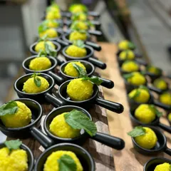 Bite-sized appetizers served in individual miniature pans. This unique presentation makes it easy for guests to enjoy while mingling.
