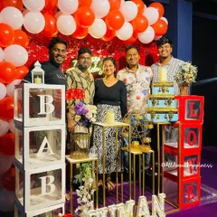 A happy group posing with the decor at one of our private screening events. We can customize the setup with props like 'BABY' and 'LOVE' blocks to suit any occasion.