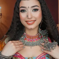 A close-up of our Navratri special look, featuring intricate dot work, oxidized silver jewelry, and a bright, festive color palette.