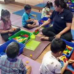 Children are focused on their building projects during a summer camp session. This image captures the engaging and educational atmosphere of my weekly camps, which offer new activities each week to keep learning fresh and exciting.