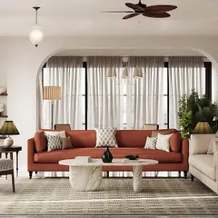 This living room embodies my minimalist philosophy where less is more. I used a palette of warm terracotta and soft neutrals to create a peaceful atmosphere, while the arched recesses and sculptural coffee table add character without overwhelming the space, creating a seamless connection between indoors and out.