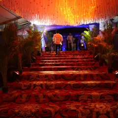For the prestigious Zee Kannada 'Hemmeya Kannadiga' awards, we created a grand celebrity entrance with a patterned red carpet, dramatic lighting, and elegant floral arrangements, ensuring a VIP experience.