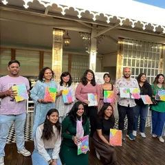 A happy group holding their colorful pastel-themed texture art. I love seeing a room full of proud new artists.