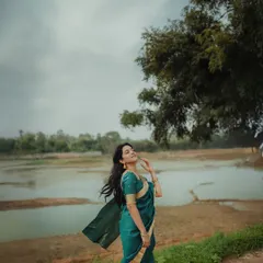 A beautiful moment captured during a shoot with the lovely actress Mirnalini Ravi. I created a soft, natural look that enhanced her features and complemented the serene outdoor setting, showing my skill in makeup for professional photography.