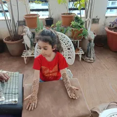 A cute little client showing off her full-arm floral mehndi for Diwali. I always use natural and safe henna, which is perfect for children's sensitive skin.