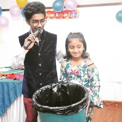 Audience participation is key to my shows. Here, a young volunteer helps me with a trick, creating a fun and interactive experience for her and all her friends at the party.